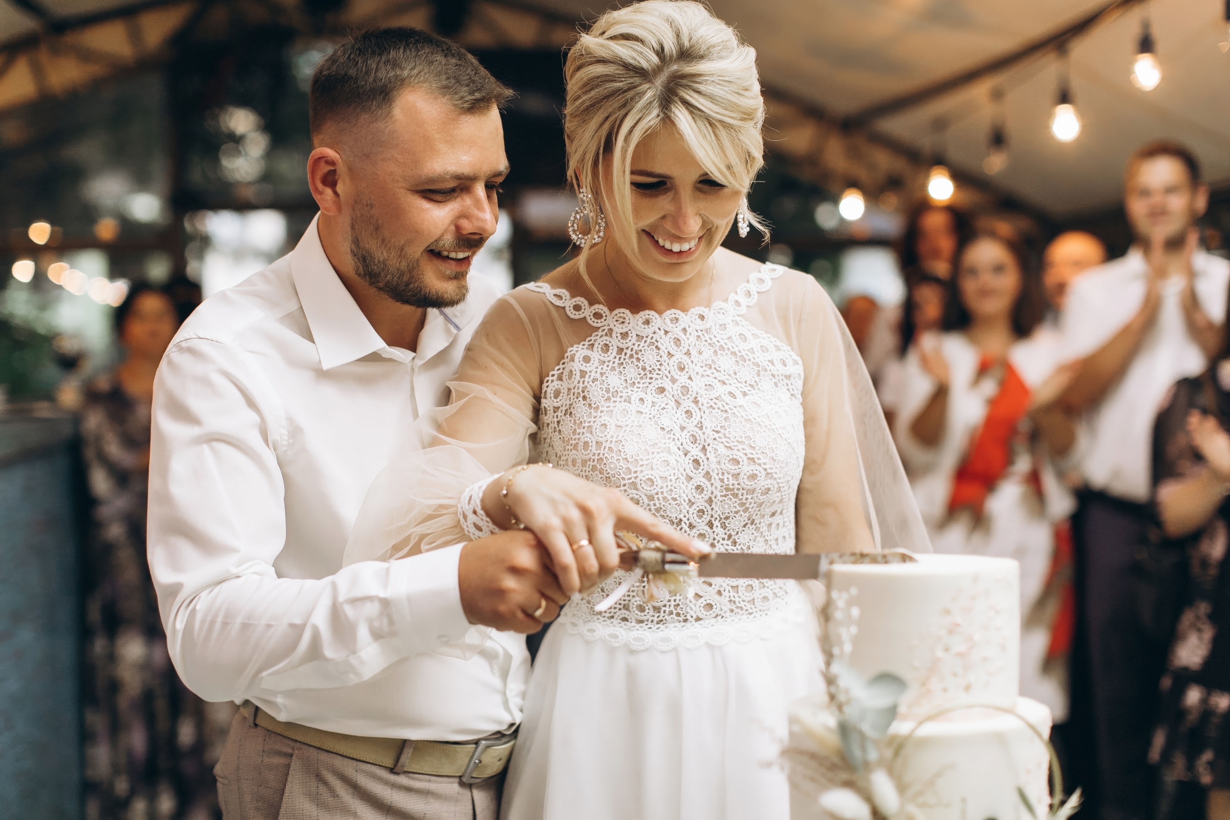 The,Wedding,Cake.,The,Bride,And,Groom,Cut,Off,A