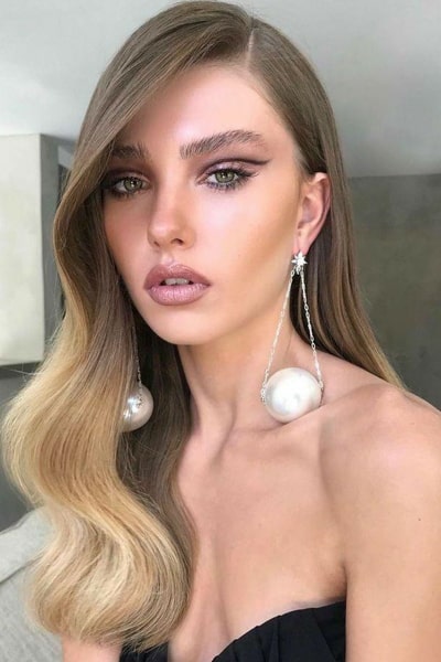 Editorial makeup with an elaborate hairstyle