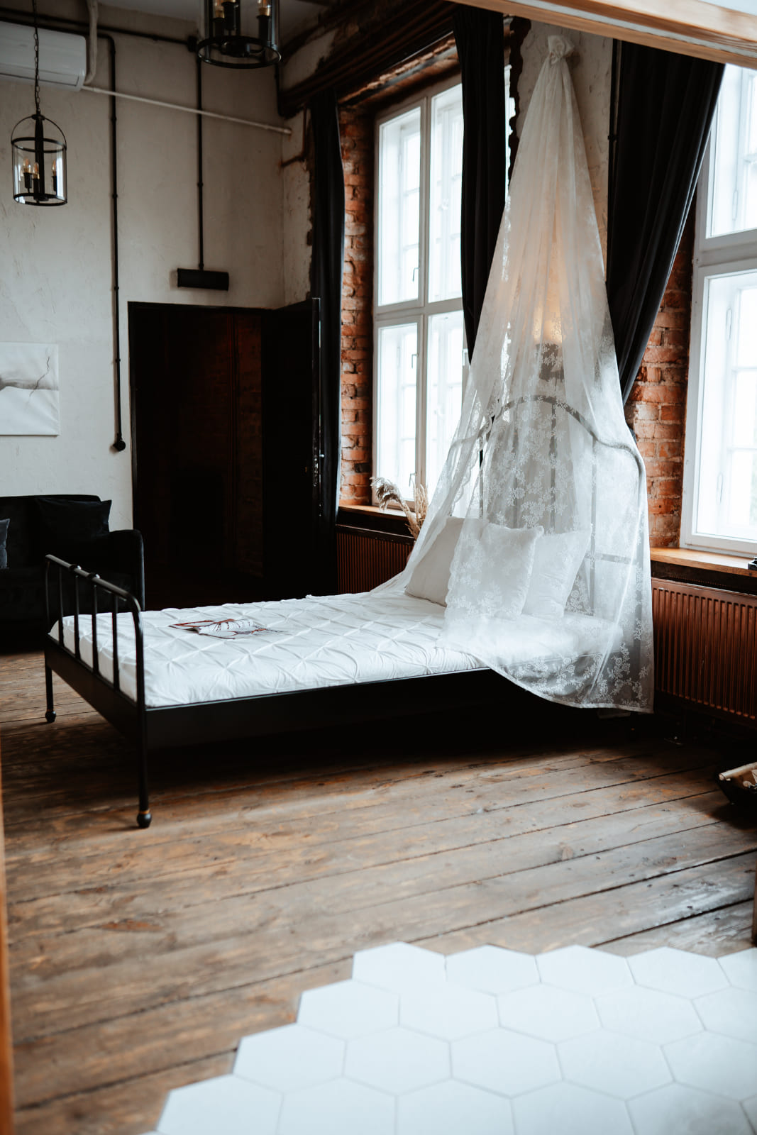 Canopy bed room with a white bathtub, boudoir photoshoot atelier in Warsaw